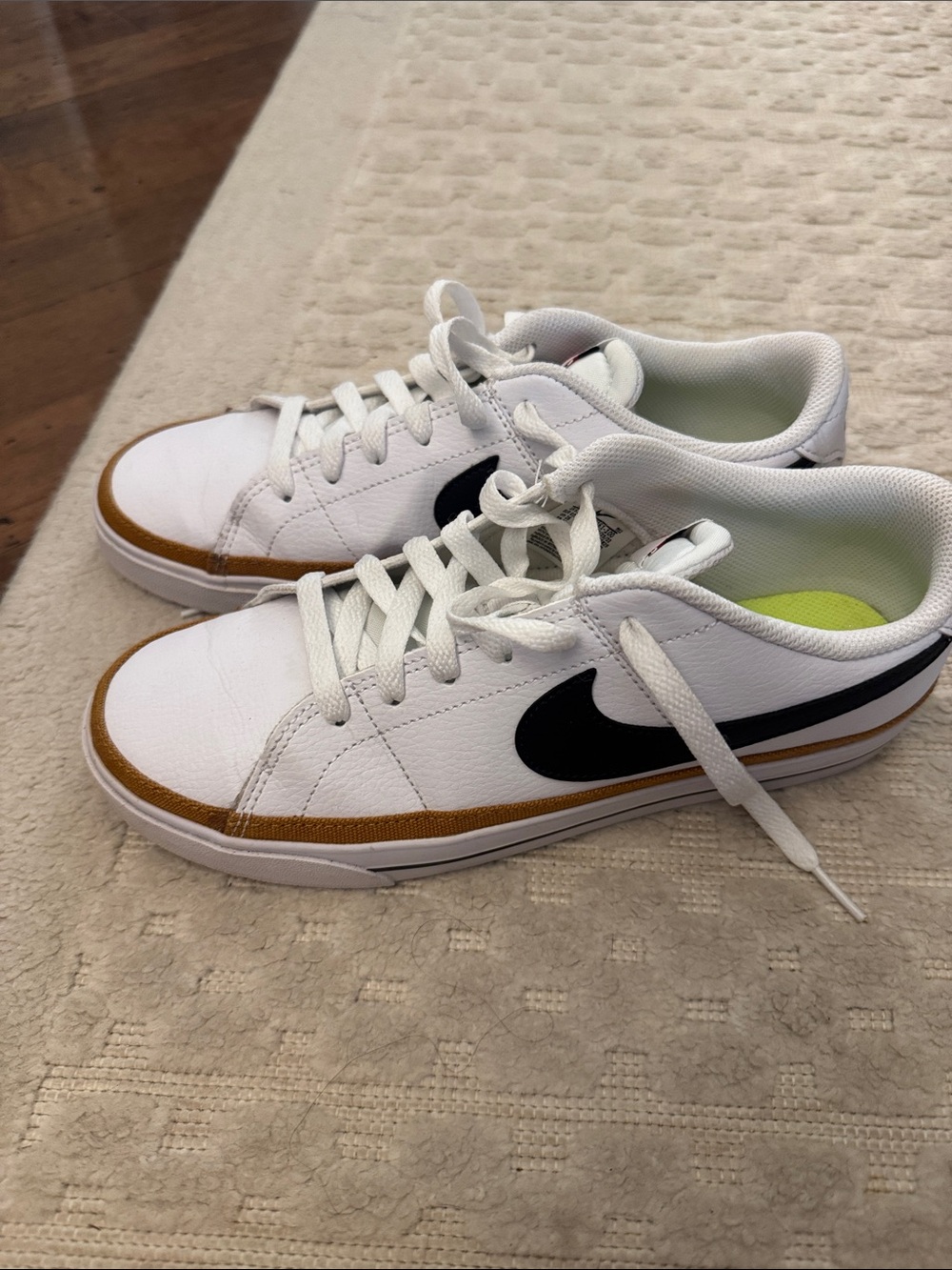 Nike White Sneakers with Black Swoosh and Brown Trim